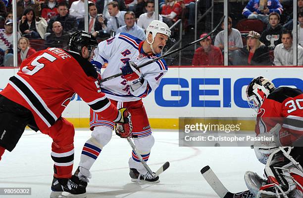Sean Avery of the New York Rangers watches his shot on goal be stopped by Martin Brodeur of the New Jersey Devils during the second period at the...