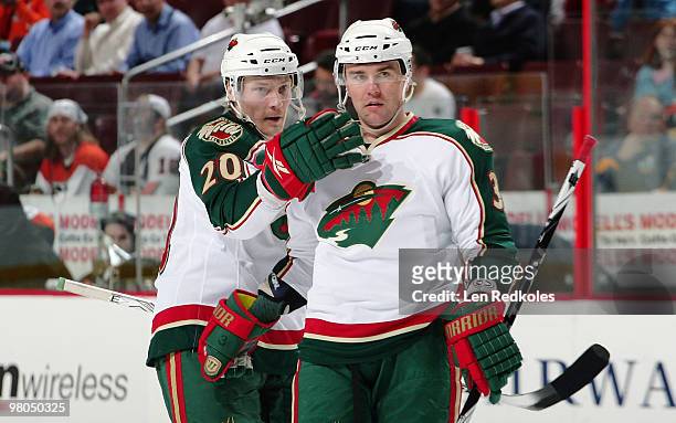 Antti Miettinen and Marek Zidlicky of the Minnesota Wild celebrate Zidlicky's power-play goal 34 seconds into the second period against the...