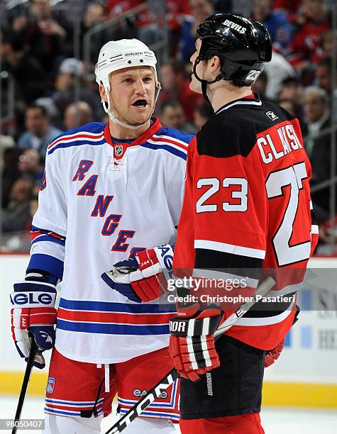 Sean Avery of the New York Rangers and David Clarkson of the New Jersey Devils exchange a few words prior to the face-off during the second period at...