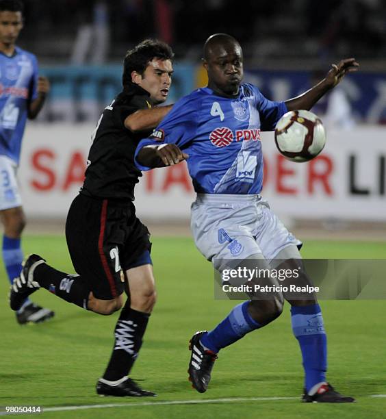 Deportivo Quito's Franco Niell vies for the ball with Emelec's Luis Zambrano during a 2010 Libertadores Cup match at the Atahualpa Stadium on March...