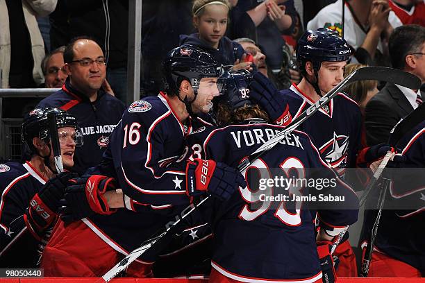 Derick Brassard congratulates Jakub Voracek, both of the Columbus Blue Jackets, after Voracek scored a goal on a penalty shot against the Chicago...