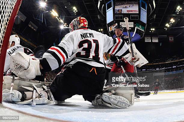 Goaltender Antti Niemi of the Chicago Blackhawks is unable to stop a shot from Andrew Murray of the Columbus Blue Jackets during the second period on...