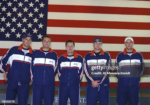 The United States team poses in front of an American flag after the 2004 David Cup semifinal draw ceremony September 23, 2004 aboard the USS Yorktown...