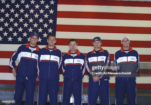 The United States team poses in front of an American flag after the 2004 David Cup semifinal draw ceremony September 23, 2004 aboard the USS Yorktown...