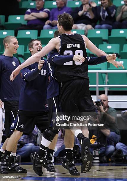 Nick Rodgers, Chase Stigall and Gordon Hayward of the Butler Bulldogs celebrate after defeating the Syracuse Orange during the west regional...