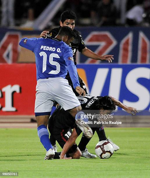 Deportivo Quito's Fernando Saritama vies for the ball with Emelec's Pedro Quinonez during a 2010 Libertadores Cup match at the Atahualpa Stadium on...