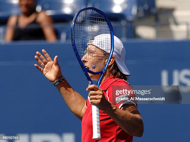 Martina Navratilova protests a line call and teams with Anna-Lena Groenefeld to advance from the 2005 U. S. Open quarterfinals in women's doubles...