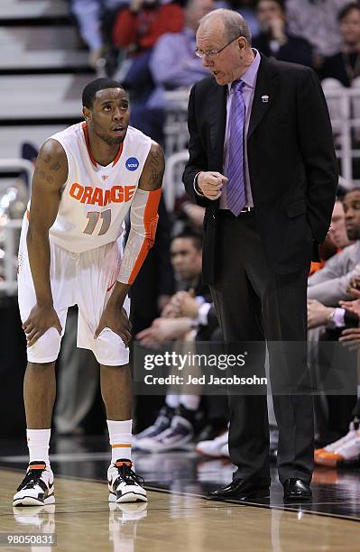 Head coach Jim Boeheim of the Syracuse Orange speaks to Scoop Jardine against the Butler Bulldogs during the west regional semifinal of the 2010 NCAA...