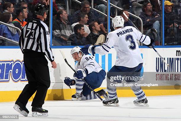 Mikhail Grabovski of the Toronto Maple Leafs celebrates with teammate Dion Phaneuf after scoring the game-winning goal in overtime against the...