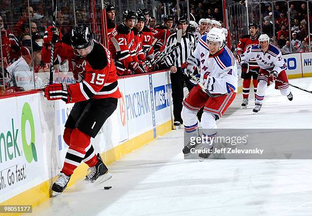 Ryan Callahan of the New York Rangers chases Jamie Langenbrunner of the New Jersey Devils at the Prudential Center on March 25, 2010 in Newark, New...