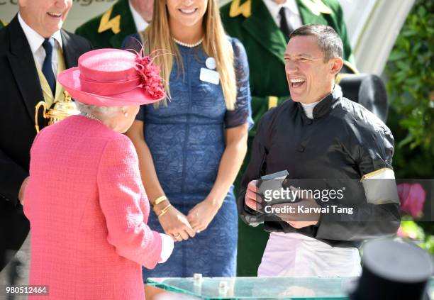 Queen Elizabeth II presents Frankie Dettori with his prize after he rode Stradivarius to win The Gold Cup on day 3 at Ascot Racecourse on June 21,...