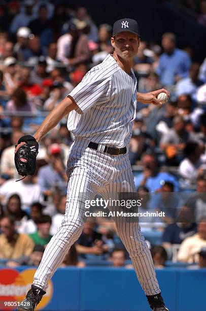 New York Yankees pitcher Randy Johnson shws a pickoff move against the Kansas City Royals at Yankee Stadium in New York, New York on April 13, 2006....