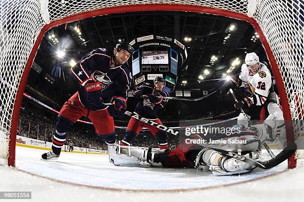 Fedor Tyutin and Samuel Pahlsson help defend though goaltender Steve Mason, all of the Columbus Blue Jackets is unable to stop the shot from Tomas...