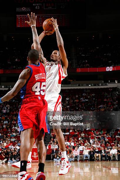 Trevor Ariza of the Houston Rockets shoots the ball over Rasual Butler of the Los Angeles Clippers on March 25, 2010 at the Toyota Center in Houston,...