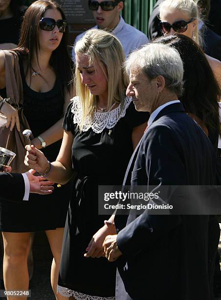 Family members, sister Arielle Bird and father Phil Bird bless the casket of Saxon Bird, the NSW under 19 Ironman champion who died whilst competing...