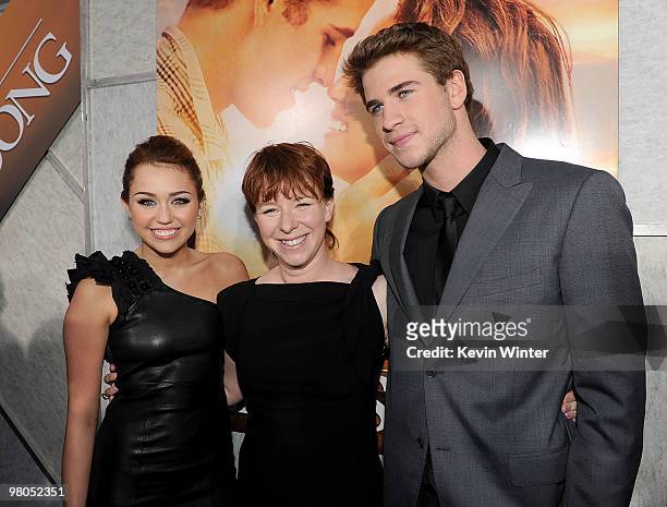 Actress/singer Miley Cyrus, director Julie Anne Robinson, and actor Liam Hemsworth arrive at the premiere of Touchstone Picture's "The Last Song"...