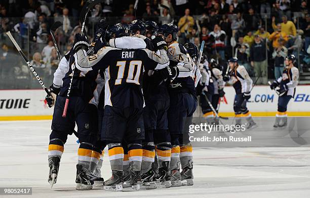 Martin Erat of the Nashville Predators celebrates with teammates after defeating the Phoenix Coyotes in a shootout on March 25, 2010 at the...