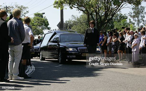 Mourners line the streets during a funeral precession for Saxon Bird, the NSW under 19 Ironman champion who died whilst competing in the Australian...