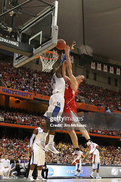 Jeff Foote of the Cornell Big Red attempts a shot against Patrick Patterson of the Kentucky Wildcats during the east regional semifinal of the 2010...