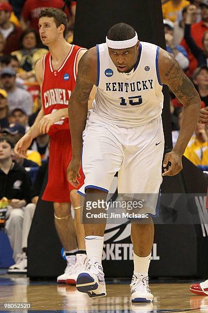 DeMarcus Cousins of the Kentucky Wildcats reacts after he dunked in the first half against the Cornell Big Red during the east regional semifinal of...