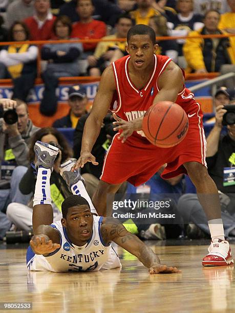 DeAndre Liggins of the Kentucky Wildcats loses the ball against Louis Dale of the Cornell Big Red during the east regional semifinal of the 2010 NCAA...