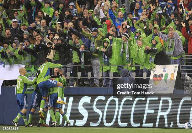 Brad Evans of the Seattle Sounders FC celebrates his goal with teammates during a game against the Philadelphia Union at Qwest Field on March 25,...