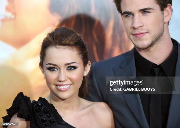 Actress and singer Miley Cyrus and actor Liam Hemsworth arrive for the premiere of "The last song" in Hollywood, California on March 25, 2010. AFP...