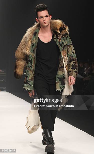 Model showcases GUT'S DYNAMITE CABARETS 2010-2011 Autumn/Winter Collection designed by "Cabaret Aki and Jackal Kuzu" on the catwalk at Tokyo Midtown...