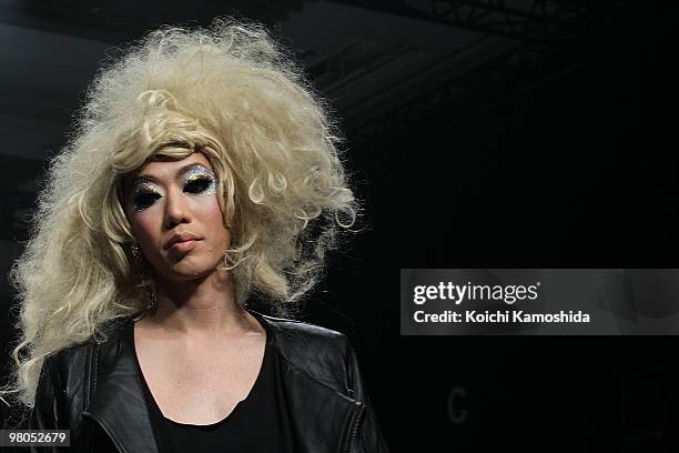 Model showcases GUT'S DYNAMITE CABARETS 2010-2011 Autumn/Winter Collection designed by "Cabaret Aki and Jackal Kuzu" on the catwalk at Tokyo Midtown...