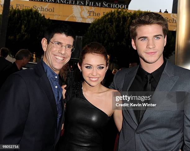 Chairman of The Walt Disney Studios Rich Ross, actress/singer Miley Cyrus, and actor Liam Hemsworth arrive at the premiere of Touchstone Picture's...