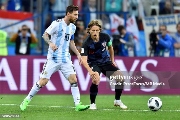 Luka Modric of Croatia competes with Lionel Messi of Argentina during the 2018 FIFA World Cup Russia group D match between Argentina and Croatia at...