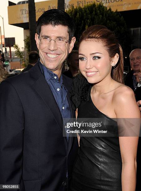 Chairman of The Walt Disney Studios Rich Ross and actress/singer Miley Cyrus arrive at the premiere of Touchstone Picture's "The Last Song" held at...