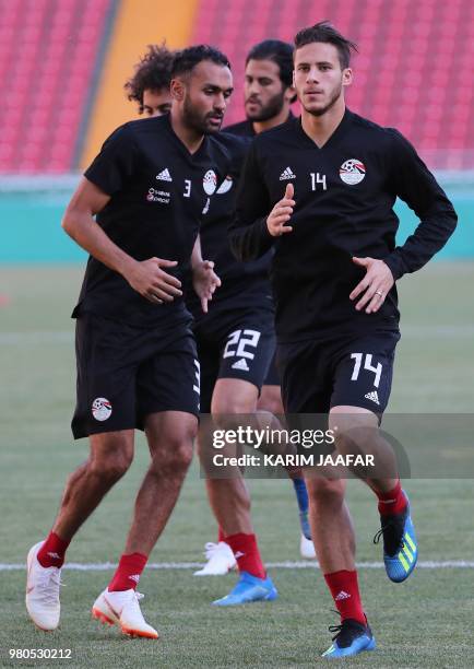 Egypt's defender Ahmed Elmohamady and Egypt's midfielder Ramadan Sobhi take part in a training session at the Akhmat Arena Stadium in Grozny on June...