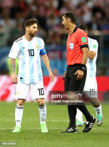 Lionel Messi of Argentina speaks with referee Ravshan Irmatov during the 2018 FIFA World Cup Russia group D match between Argentina and Croatia at...