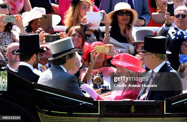 Queen Elizabeth ll and Prince Andrew, Duke of York arrive in an open carriage to attend the third day of Royal Ascot on June 21, 2018 in Ascot,...