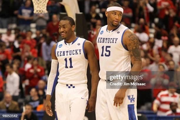 John Wall and DeMarcus Cousins of the Kentucky Wildcats react late in the second half against the Cornell Big Red during the east regional semifinal...