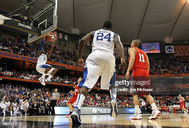 John Wall of the Kentucky Wildcats dunks in the second half against the Cornell Big Red during the east regional semifinal of the 2010 NCAA men's...