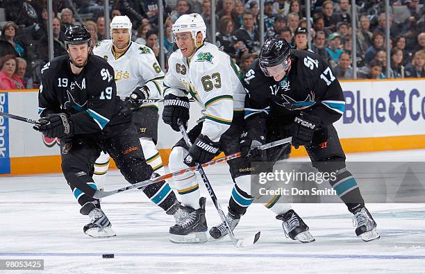 Trevor Daley and Mike Ribeiro of the Dallas Stars battle for possession of the puck against Joe Thornton and Torrey Mitchell of the San Jose Sharks...