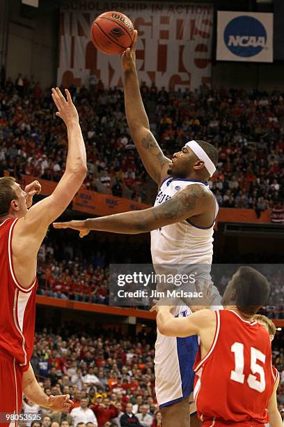 DeMarcus Cousins of the Kentucky Wildcats attempts a shot against Jeff Foote of the Cornell Big Red during the east regional semifinal of the 2010...