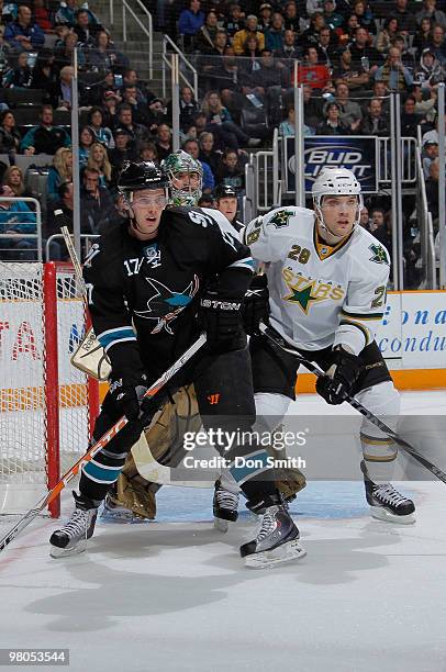 Torrey Mitchell of the San Jose Sharks waits in the crease in front of Mark Fistric and Marty Turco of the Dallas Stars during an NHL game on March...