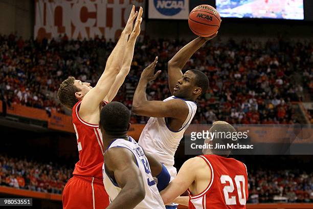 Darius Miller of the Kentucky Wildcats drives for a shot attempt against the Cornell Big Red during the east regional semifinal of the 2010 NCAA...