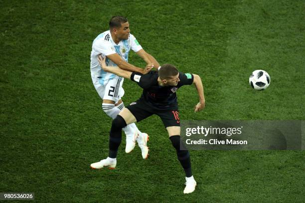 Ante Rebic of Croatia is challenged by Gabriel Mercado of Argentina during the 2018 FIFA World Cup Russia group D match between Argentina and Croatia...