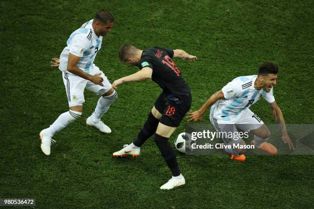 Ante Rebic of Croatia fouls Eduardo Salvio of Argentina under pressure from Gabriel Mercado of Argentina, leading to Ante Rebic of Croatia recieving...