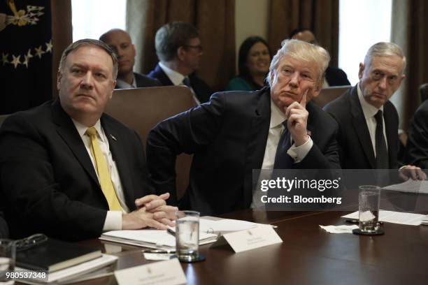 President Donald Trump, center, Mike Pompeo, U.S. Secretary of state, left, and James Mattis, US secretary of defense, listen during a Cabinet...