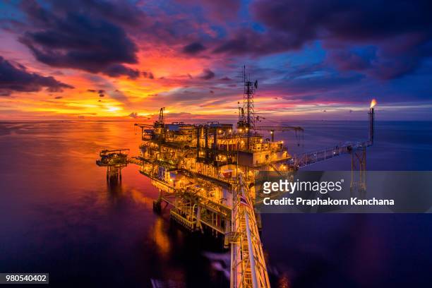 oil platform at dusk - oil rig stock pictures, royalty-free photos & images
