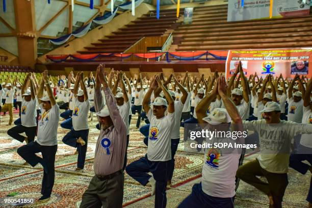 People practicing Yoga in the presence of the Governor of Jammu and Kashmir N.N. Vohra on the international day for Yoga in Indore stadium Srinagar...