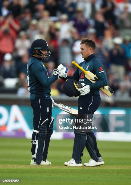 Jason Roy of England celebrates with Jonny Bairstow after scoring 100 runs during the 4th Royal London ODI match between England and Australia at...