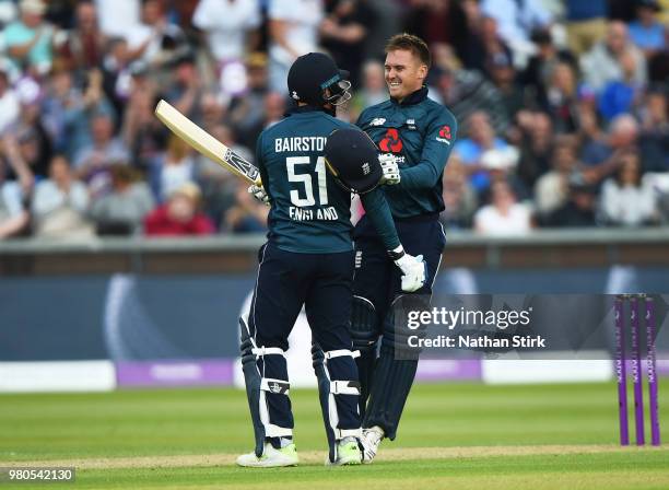 Jason Roy of England celebrates with Jonny Bairstow after scoring 100 runs during the 4th Royal London ODI match between England and Australia at...