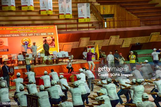 People practicing Yoga in the presence of the Governor of Jammu and Kashmir N.N. Vohra on the international day for Yoga in Indore stadium Srinagar...