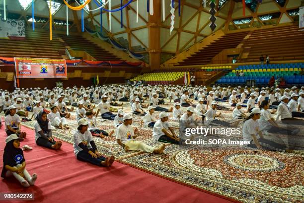 Children practicing Yoga in the presence of Govenor Of Jammu and Kashmir N.N. Vohra on the international day for Yoga in Indore stadium Srinagar...